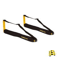 Two black padded canoe racks with yellow support posts and adjustable straps