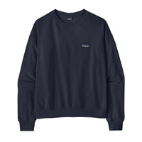 Women's navy blue crewneck sweatshirt with small logo patch, flat lay front view