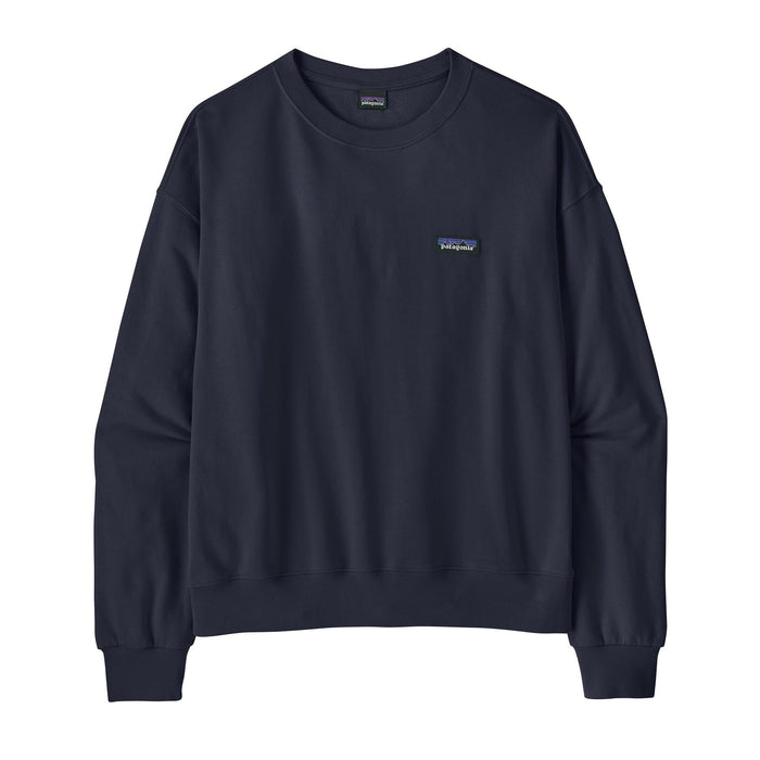 Women's navy blue crewneck sweatshirt with small logo patch, flat lay front view