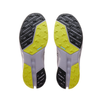 Trail running shoe sole view showing gray, yellow and black rubber traction pattern