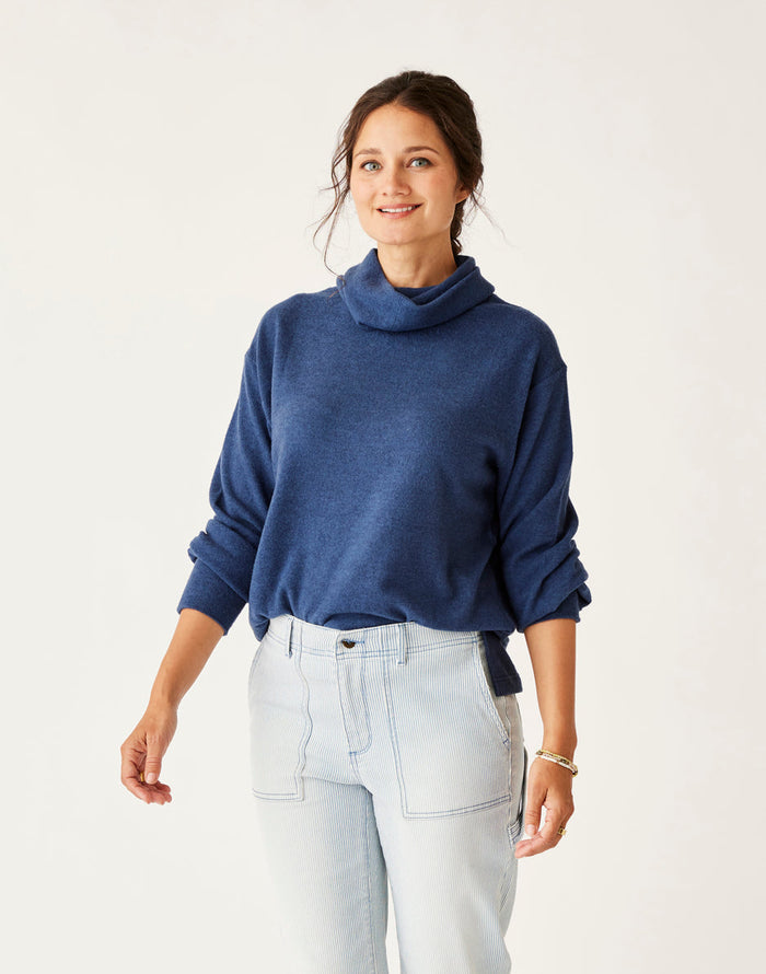 Women's turtleneck pullover sweater in heathered blue, relaxed fit, front view on model
